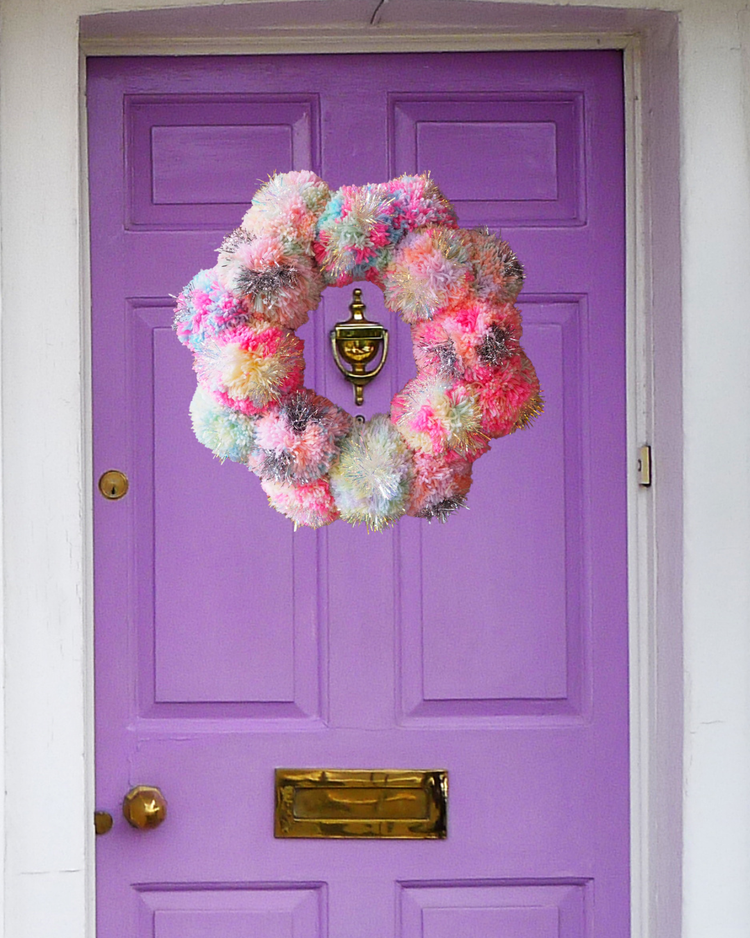 XL tinsel Christmas wreath on front doors