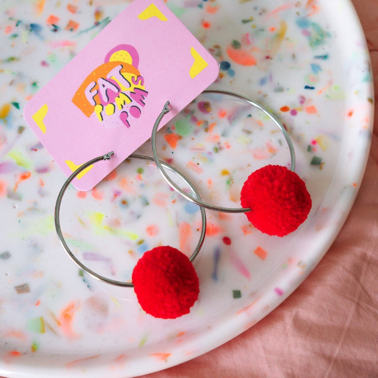 Red pom pom large hoop earrings