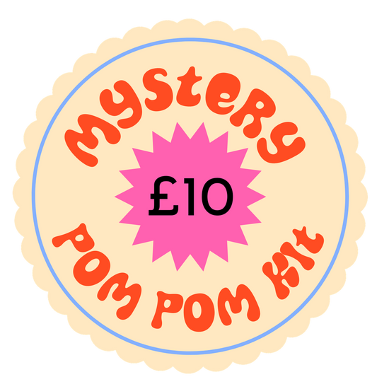 Round label with 'Mystery Pom Pom Kit £10' text on a white background