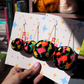 Black Floral Meadow Pom Pom Earrings