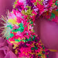 Diadema con pompones iridiscentes de oropel 